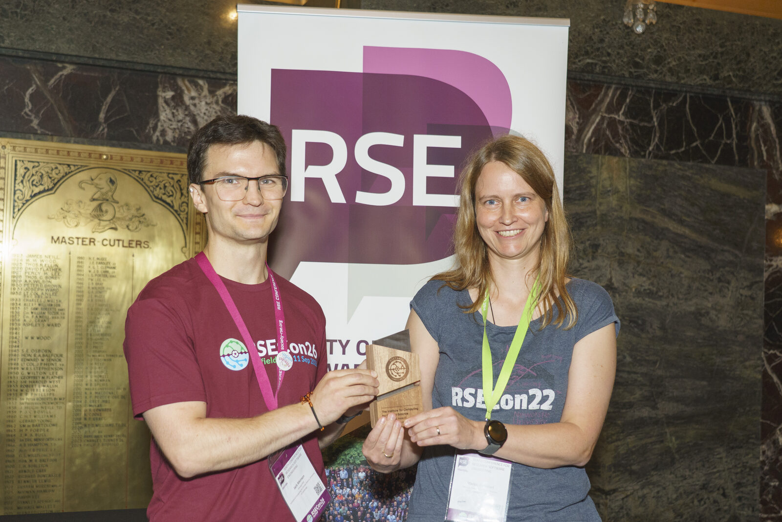 Marion and I receiving the teaching and training community award. Photo by Society of Research Software Engineering /Dominic Lipinski, licensed under CC BY-NC 4.0 .